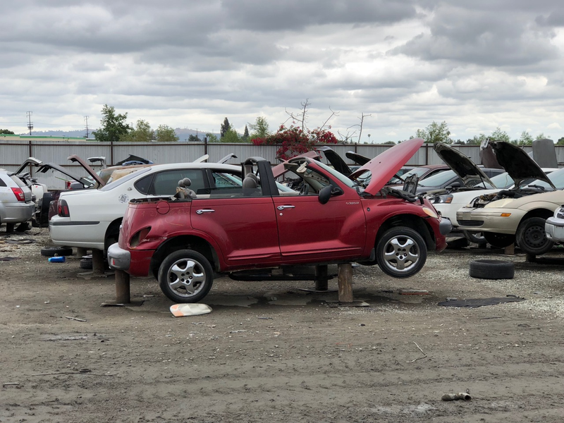 Illustration for article titled This Junkyard PT Cruiser Landaulet Proves Some Battles Can't Be Won